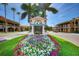 A welcoming 'Venice' sign surrounded by vibrant flower beds and lush green lawns, enhancing the city's charm at 740 Tanager Rd, Venice, FL 34293