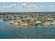 Scenic aerial showing the restaurant, waterfront, parking and canal at 7515 Greystone Dr, Hudson, FL 34667