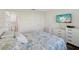 Comfortable bedroom with a bed, TV, and a view of the bathroom with a toilet and tiled shower in view at 7515 Greystone Dr, Hudson, FL 34667