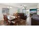 Comfortable living space featuring a dining area, and sliding glass doors for lots of light at 7515 Greystone Dr, Hudson, FL 34667