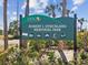 Robert J. Strickland Memorial Park sign with a list of recreational activities available at 7515 Greystone Dr, Hudson, FL 34667