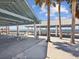 Covered picnic pavilions with tables and seating and beach views on a sunny day at 7515 Greystone Dr, Hudson, FL 34667