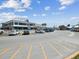 A view of a waterfront restaurant with outdoor patio seating and a parking lot at 7515 Greystone Dr, Hudson, FL 34667