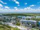Aerial view of condominium complex showcasing landscaping, parking, and amenities at 8403 Placida Rd # 205, Placida, FL 33946