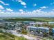 Aerial view of condominium complex, showcasing the landscaping, parking, and community amenities at 8403 Placida Rd # 205, Placida, FL 33946