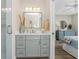 Elegant bathroom with a glass-enclosed shower and a vanity with a marble countertop at 8403 Placida Rd # 205, Placida, FL 33946