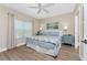 Comfortable bedroom with a ceiling fan and a window, offering a relaxing atmosphere at 8403 Placida Rd # 205, Placida, FL 33946