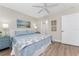 Well-lit bedroom featuring a ceiling fan and art decor, creating a serene retreat at 8403 Placida Rd # 205, Placida, FL 33946