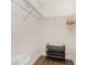 Walk-in closet boasts a metal shelf, hanging rack, and floor shelf, perfect for organized storage solutions at 8403 Placida Rd # 205, Placida, FL 33946