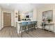 Kitchen area featuring breakfast bar, stainless appliances, and hardwood floors at 8403 Placida Rd # 205, Placida, FL 33946