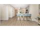 Kitchen and dining area featuring breakfast bar, stainless appliances, and luxury floors at 8403 Placida Rd # 205, Placida, FL 33946