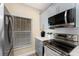 Updated kitchen with stainless steel appliances, light-colored cabinetry, and hardwood floors at 8403 Placida Rd # 205, Placida, FL 33946