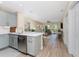 Modern kitchen featuring stainless steel appliances and light blue cabinets at 8403 Placida Rd # 205, Placida, FL 33946