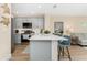 Kitchen area featuring breakfast bar, stainless appliances and hardwood floors at 8403 Placida Rd # 205, Placida, FL 33946