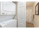 Efficient laundry area features a stacked washer and dryer unit, optimizing space and convenience at 8403 Placida Rd # 205, Placida, FL 33946
