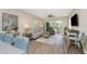 Comfortable living room with sliding glass doors and stylish decor at 8403 Placida Rd # 205, Placida, FL 33946