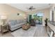 Living room with nice furniture, with sliding doors to a balcony at 8403 Placida Rd # 205, Placida, FL 33946
