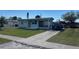 Charming single-story home with a screened porch and a long driveway at 8629 Aero Ave, North Port, FL 34287