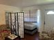 Cozy living room featuring a room divider, chairs, and decorative accents at 8629 Aero Ave, North Port, FL 34287