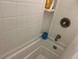 Close-up of a shower with white tile and a silver shower head at 8629 Aero Ave, North Port, FL 34287