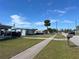 A quiet neighborhood street with well-maintained lawns and sidewalks at 8629 Aero Ave, North Port, FL 34287