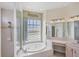 Bathroom featuring a soaking tub, vanity and a separate shower at 863 Macaw Cir, Venice, FL 34285
