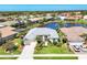 Stunning waterfront home with well-manicured lawn, lovely landscaping, and community water feature in the backyard at 863 Macaw Cir, Venice, FL 34285