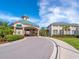 Stunning clubhouse featuring covered entrance and well-manicured landscaping at 867 Macaw Cir, Venice, FL 34285