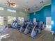 Bright and airy fitness center with several treadmills, stationary bikes, and other exercise equipment at 867 Macaw Cir, Venice, FL 34285