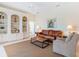 Comfortable living room featuring custom built-in shelving and neutral decor at 867 Macaw Cir, Venice, FL 34285