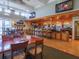 Elegant clubhouse restaurant with a bar area and multiple tables for dining and socializing at 867 Macaw Cir, Venice, FL 34285