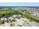 Aerial view of a beautiful residential neighborhood with well-maintained homes, lush landscaping, and a serene canal at 9312 Coachman Dr, Venice, FL 34293