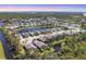 Scenic aerial view of the community showcasing the homes, ponds, and lush greenery at 9312 Coachman Dr, Venice, FL 34293