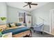 Nicely decorated bedroom with charming decor, a comfortable bed, and a window at 9312 Coachman Dr, Venice, FL 34293