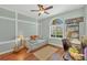 Stylish bedroom with lots of light, featuring hardwood floors, desk, and a decorative theme at 9312 Coachman Dr, Venice, FL 34293