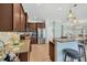 Well-appointed kitchen with granite countertops, stainless steel appliances, and a breakfast bar at 9312 Coachman Dr, Venice, FL 34293