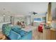 Spacious living room featuring an open floor plan with ceiling fan and serene views at 9312 Coachman Dr, Venice, FL 34293