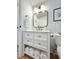 Stylish bathroom featuring a white vanity and updated fixtures at 937 Nettuno Dr, Venice, FL 34285
