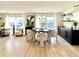 Bright dining area with stylish decor, modern light fixture, and large windows at 937 Nettuno Dr, Venice, FL 34285