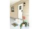 Inviting front entrance featuring a freshly painted white door, steps, and decorative flower pot at 937 Nettuno Dr, Venice, FL 34285