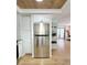 Stainless steel refrigerator seamlessly integrated into the kitchen design at 937 Nettuno Dr, Venice, FL 34285
