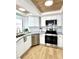Bright kitchen showcasing stainless steel appliances, granite countertops, and ample cabinet space at 937 Nettuno Dr, Venice, FL 34285