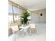 Charming screened patio with seating and plants at 937 Nettuno Dr, Venice, FL 34285