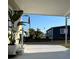 Inviting front porch showcasing a tranquil neighborhood view at 937 Nettuno Dr, Venice, FL 34285