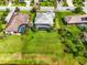 Property boundaries visible in an aerial view showing the home, pool, and lush landscaping at 988 145Th Street Ne Cir, Bradenton, FL 34212