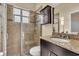 Bathroom featuring a tiled shower, granite counters and vanity at 988 145Th Street Ne Cir, Bradenton, FL 34212