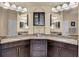 Lavish bathroom with double sinks, granite countertops, and modern dark wood cabinetry at 988 145Th Street Ne Cir, Bradenton, FL 34212