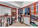 Well-organized walk-in closet with custom shelving and hanging rods for optimal storage at 988 145Th Street Ne Cir, Bradenton, FL 34212