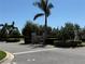 Another view of the gated community entrance showcasing lush greenery and secure access at 988 145Th Street Ne Cir, Bradenton, FL 34212