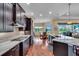 Modern kitchen with gas range, marble countertops, stainless steel appliances and breakfast nook at 988 145Th Street Ne Cir, Bradenton, FL 34212